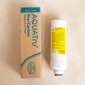 AquaTru Classic Pre/Carbon filter beside box.