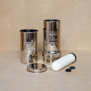 1L Adventure British Berkefeld stainless steel drinking water gravity filter with parts disassembled - side view.