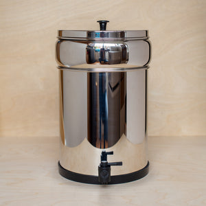 Large 12L British Berkefeld stainless steel Gravity water filter shown in compact mode with upper chamber tucked inside lower chamber for transport.
