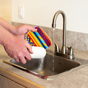 Cleaning off water filters with water and Euroscrubby scrub pad