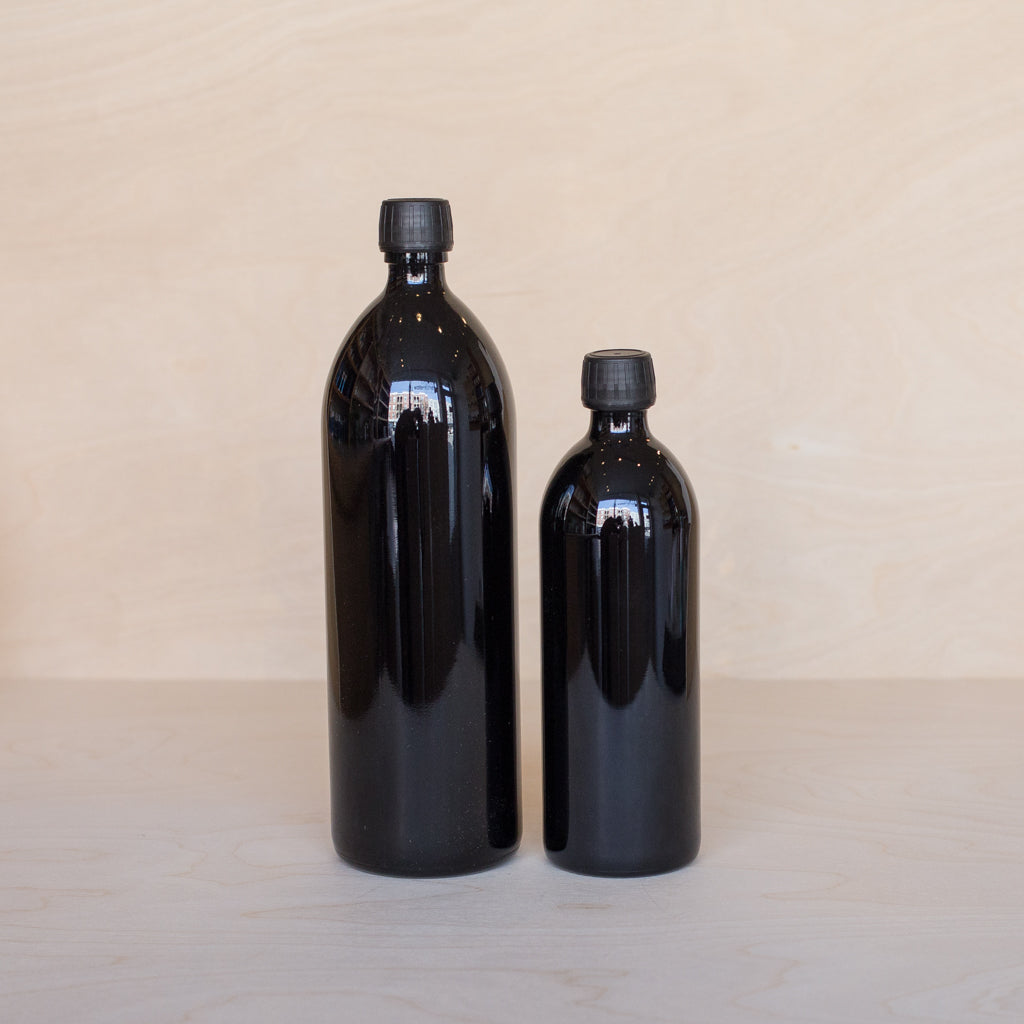 Miron Violet Glass Bottle