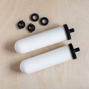 Two British Berkefeld Ultra Sterasyl ceramic filters with washers and wing nuts.