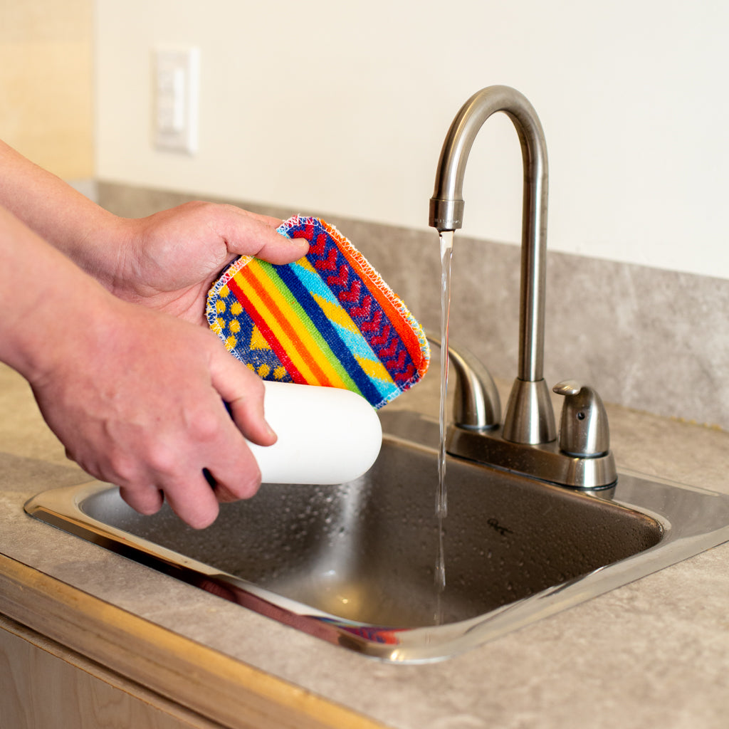 Cleaning off water filters with water and Euroscrubby scrub pad