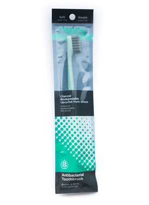 Green Happy Toothbrushes in sealed package